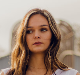 a young girl in a white T-shirt